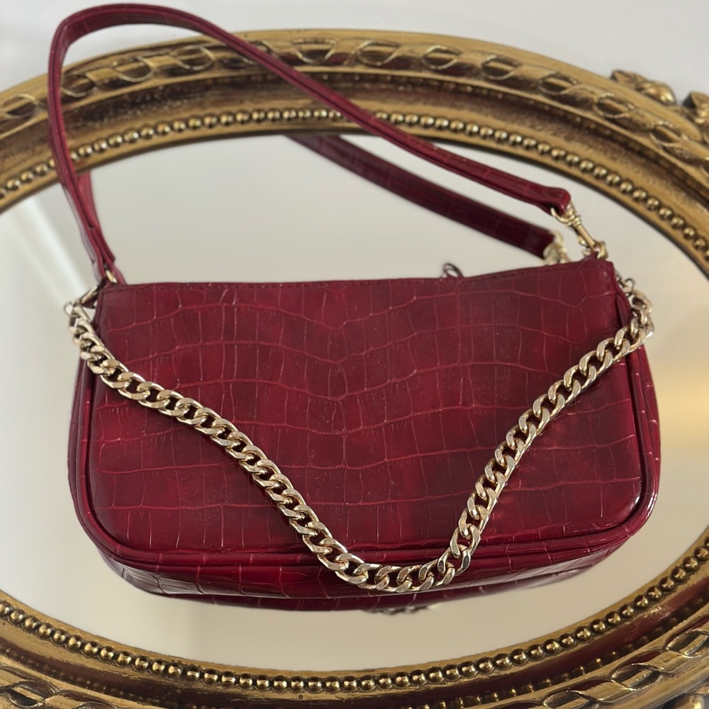 Small Red/Burgundy Bag With Gold Chain.